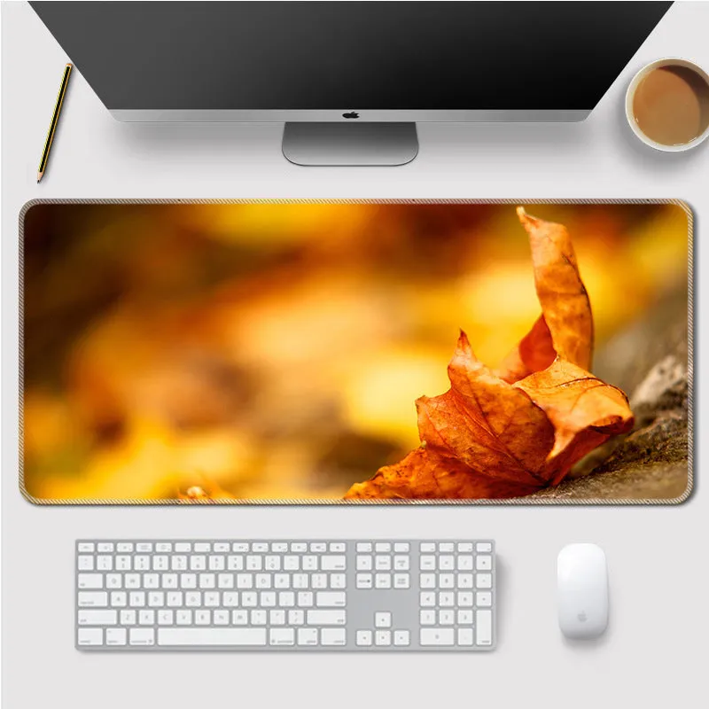 Landscape mouse mat with rubber base and cloth surface on a desk, showing heat transfer printed image