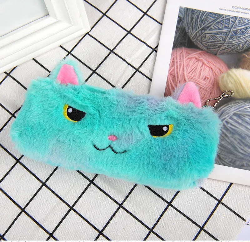 Laser colour plush pencil case with cartoon squinting face design, 21x9cm, on a plain background