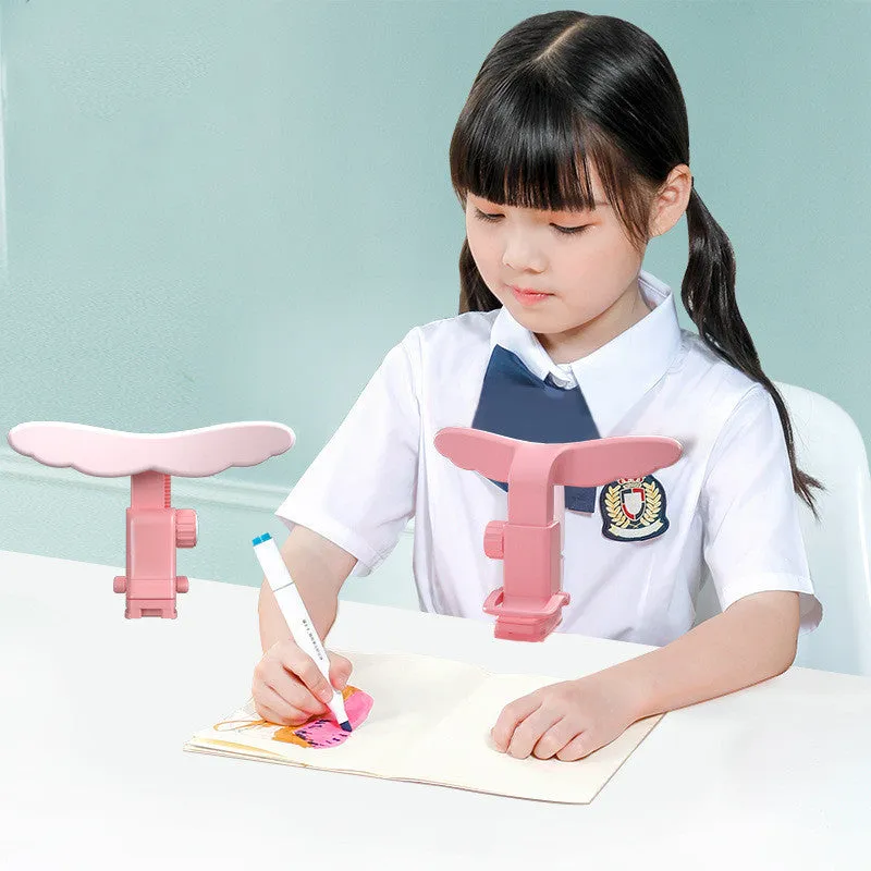 Student anti-myopia seated orthotics posture corrector with silicone chin support on a desk, blue frame