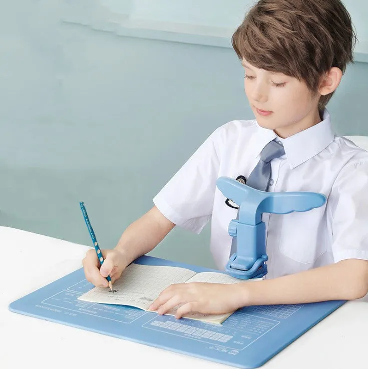 Student anti-myopia seated orthotics posture corrector with silicone chin support on a desk, blue frame