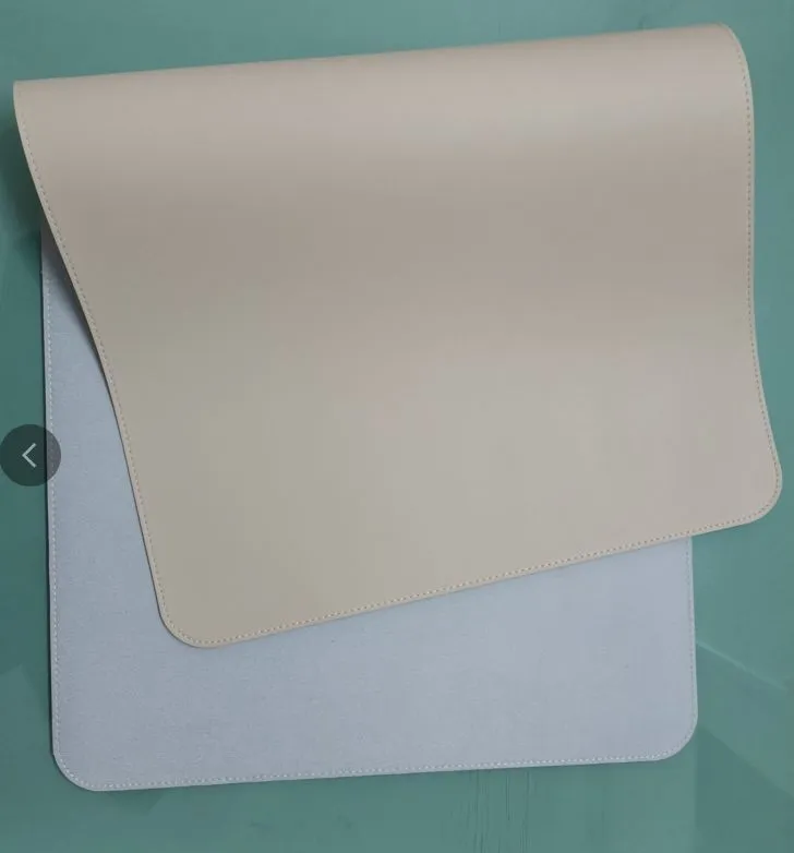 Leather desk mat in multiple sizes and colours for office or study use, shown on a desk with a computer mouse.