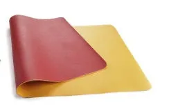 Leather desk mat in multiple sizes and colours for office or study use, shown on a desk with a computer mouse.