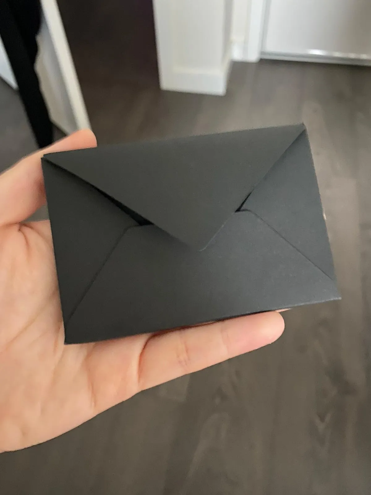 Black envelope 9x6cm on white background for invitations and cards