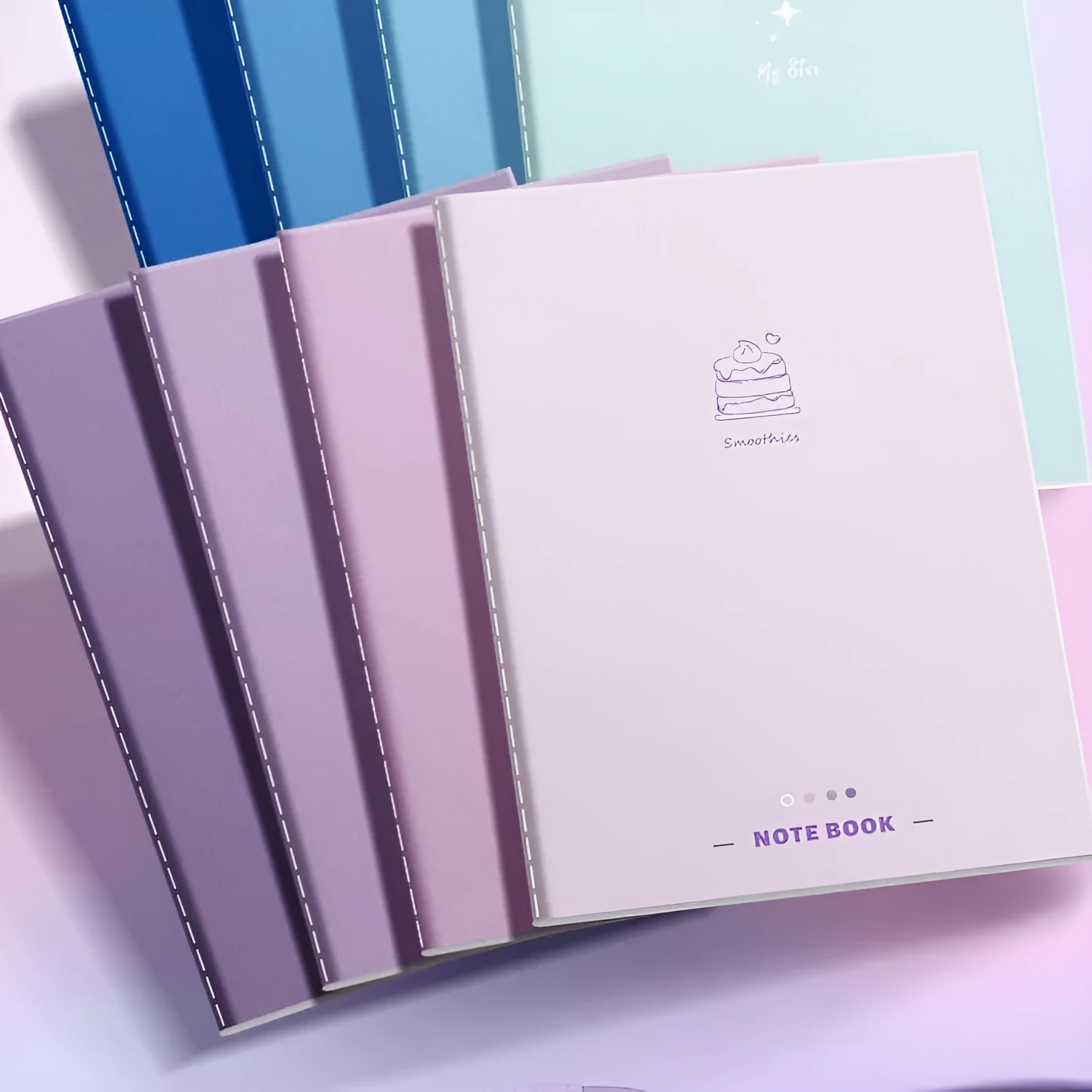 Set of 4 gradient colour notebooks with creative covers for student homework and learning.