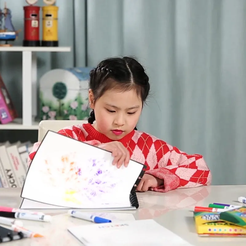Children's A4 drawing book with PP cover, 15 pages, in orange colour, laid open on a desk