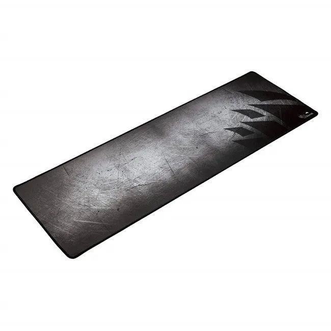 Black thickened non-slip mouse pad with rubber base and cloth surface on a desk