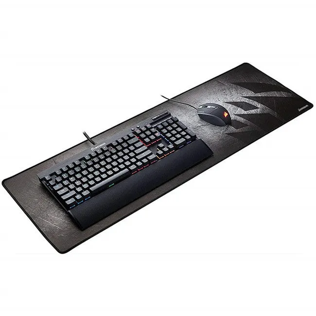 Black thickened non-slip mouse pad with rubber base and cloth surface on a desk