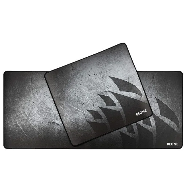 Black thickened non-slip mouse pad with rubber base and cloth surface on a desk