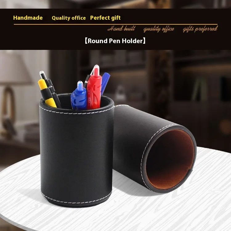 Black leather cylindrical pen holder measuring 8cm wide × 10.8cm tall on desk