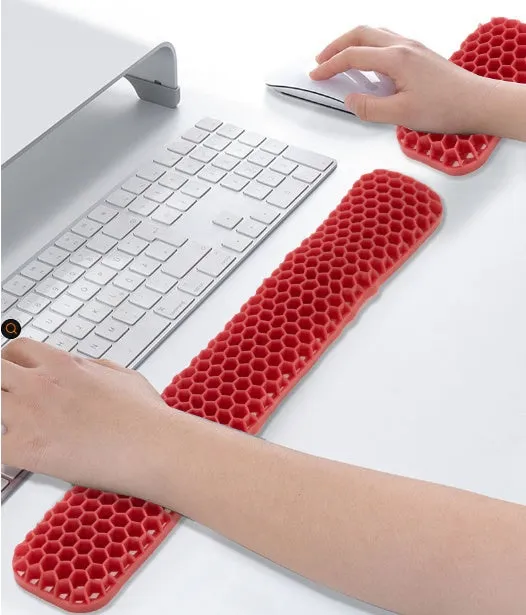 Polymer double-sided wrist rest in blue with hollow grid pattern for keyboard and mouse support