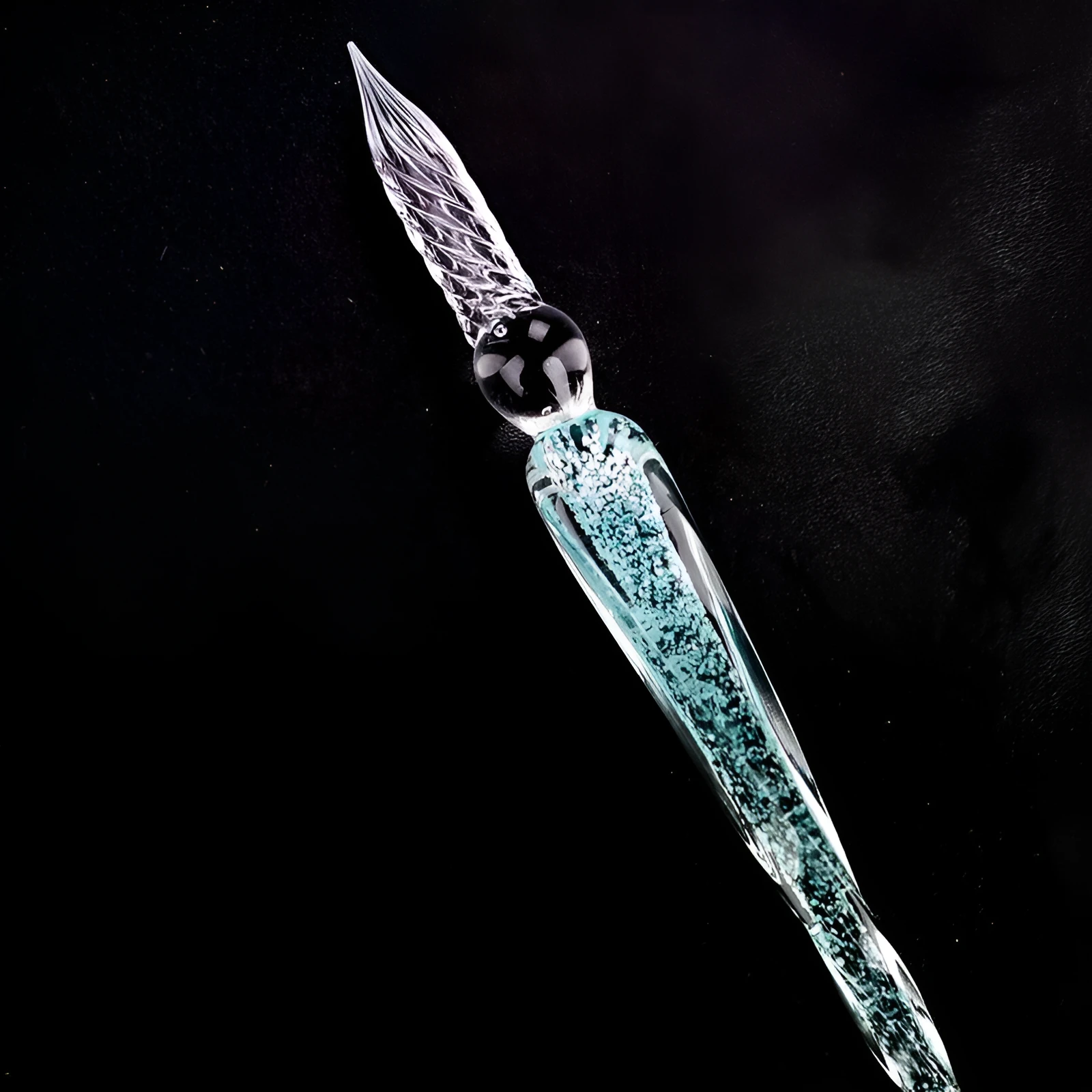 Crystal glass dip pen with transparent body and coloured ink, on a white background
