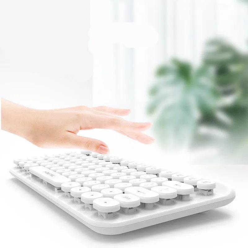 Mini 2.4G Punk Wireless Keyboard with 75 keys in white colour on flat surface