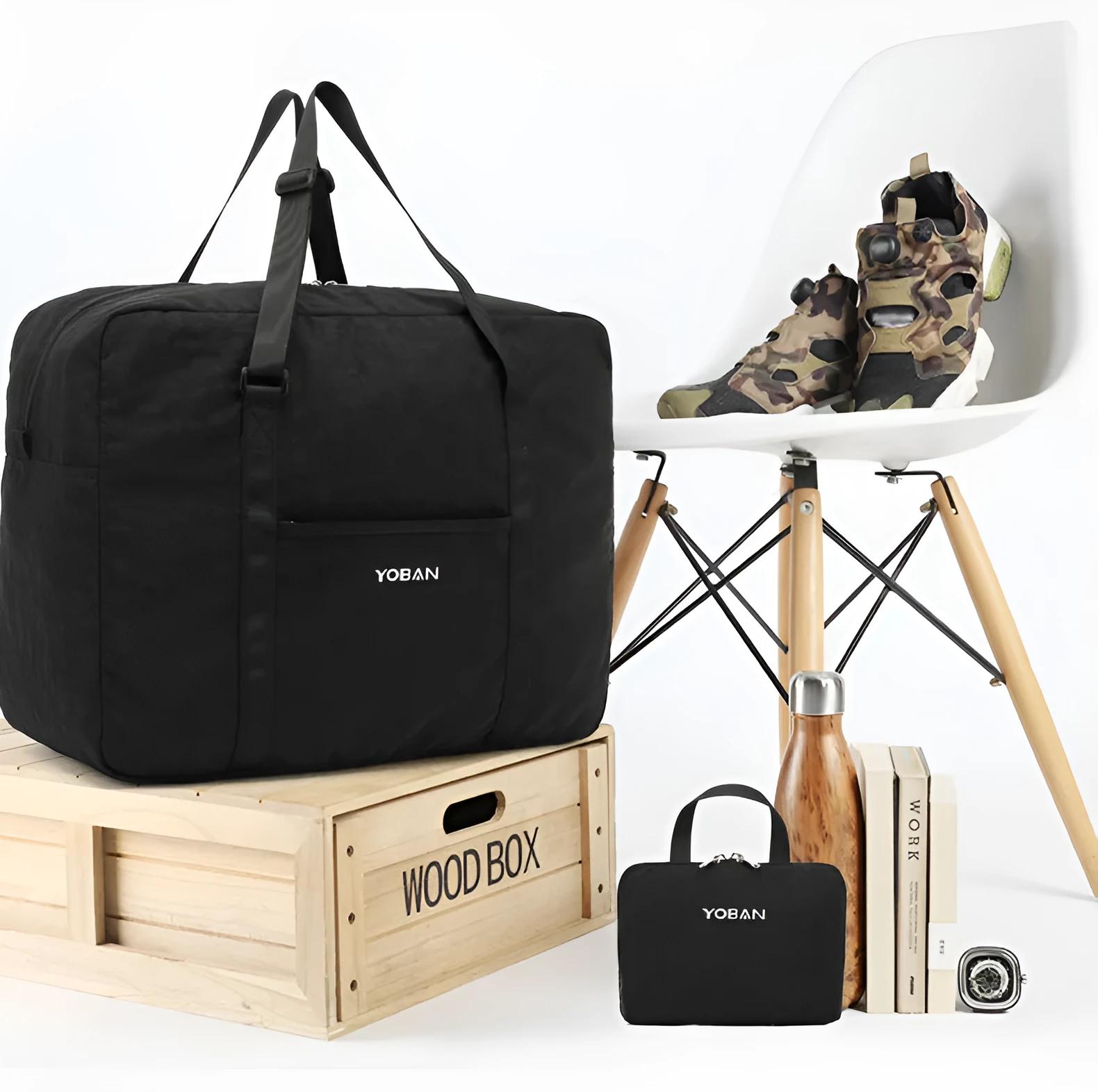 Large waterproof foldable travel bag in black with 20-35L capacity and zipper closure