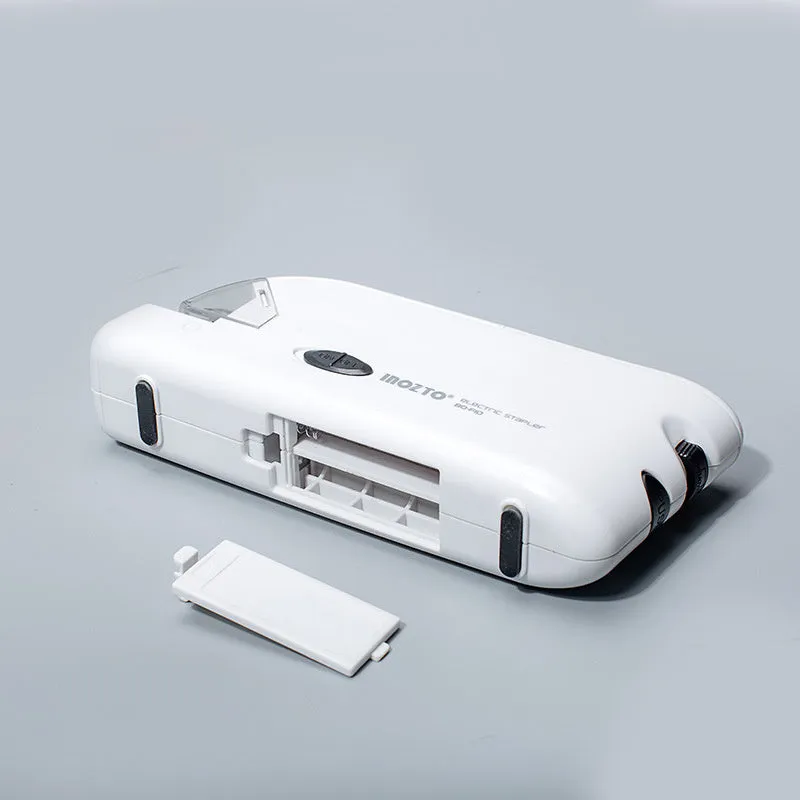 White electric flat stapler with automatic induction on desk, 184x45x84mm size