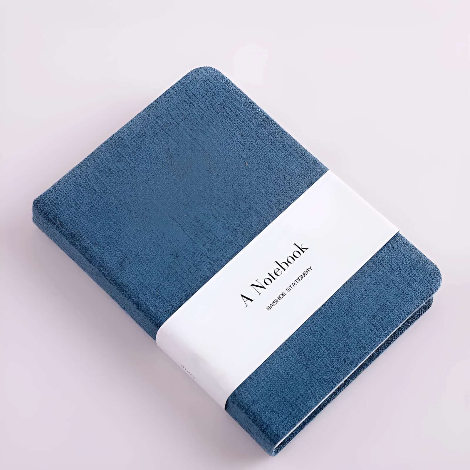 Cloth-covered wire-bound notebook with 132 pages, small size 10.5x14.5cm, showing blank and ruled pages in blue