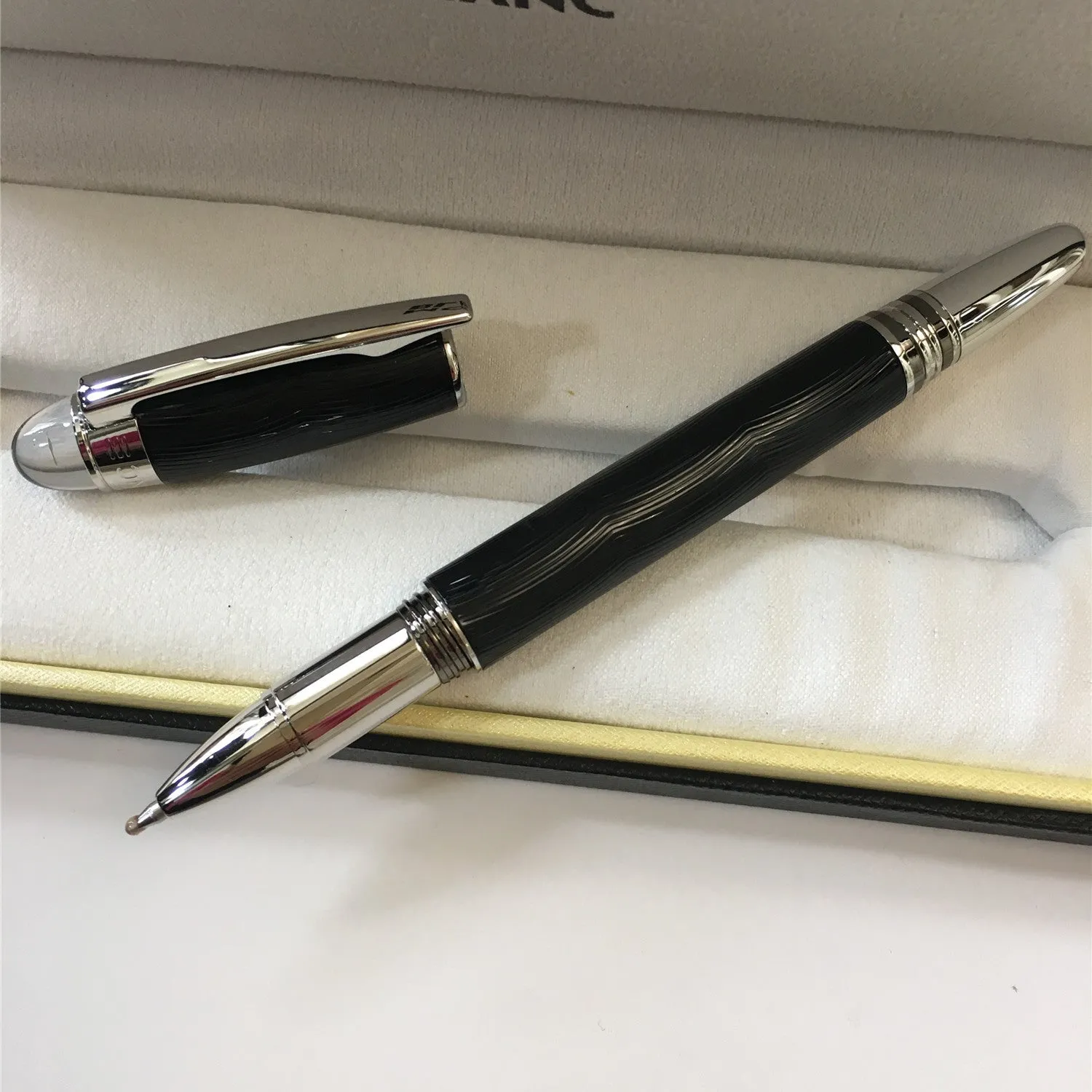 Interstellar Crystal Head series metal rollerball pen in black, with resin metal barrel and black ink refill