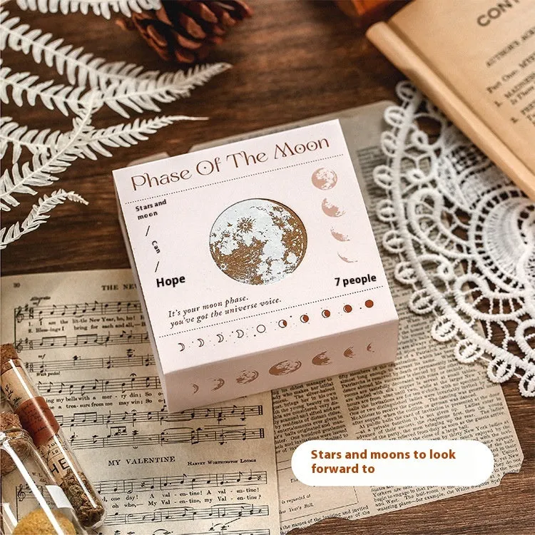 Mr Paper Seal Suit wooden stamp set showing seven stamps in either stars and moon or botanical designs on a craft table.