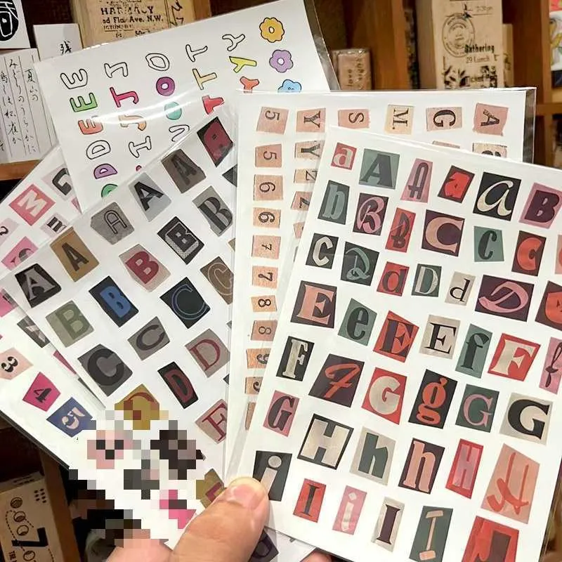 English letters and numbers symbol label sticker sheet with alphabet sets and week words in cute printed design