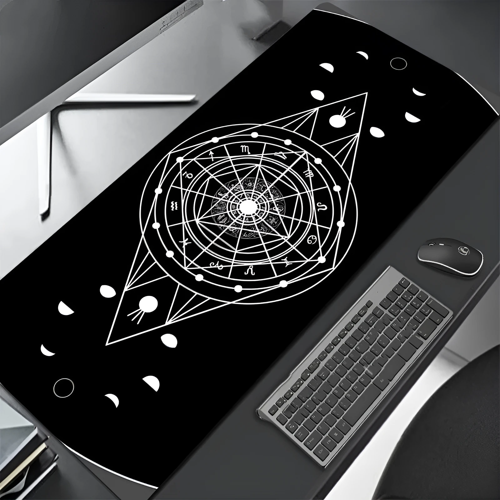 All black extra long mouse pad with precision overlock stitching on a desk