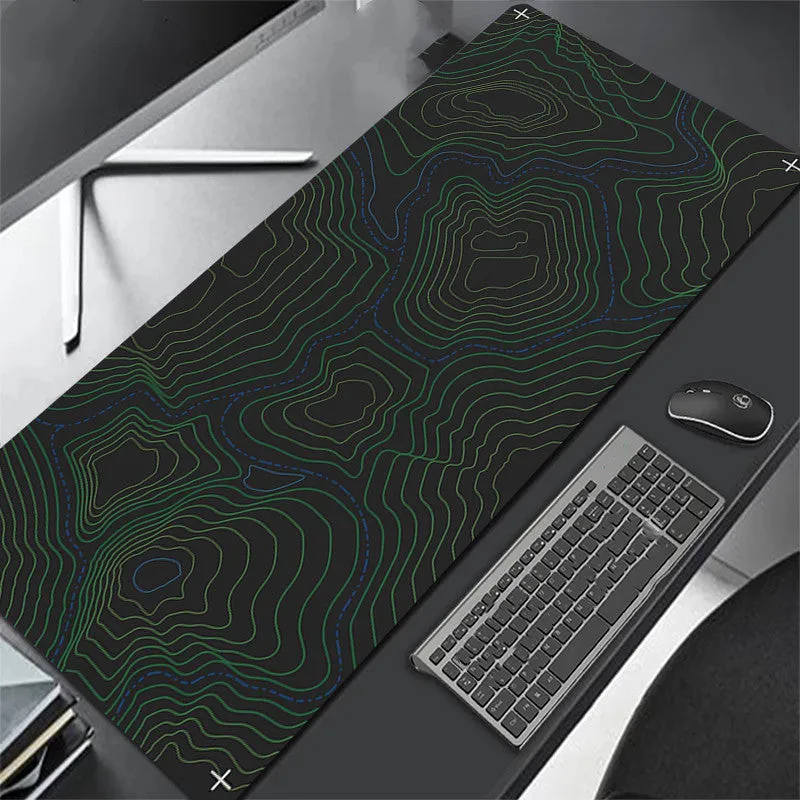 All black extra long mouse pad with precision overlock stitching on a desk