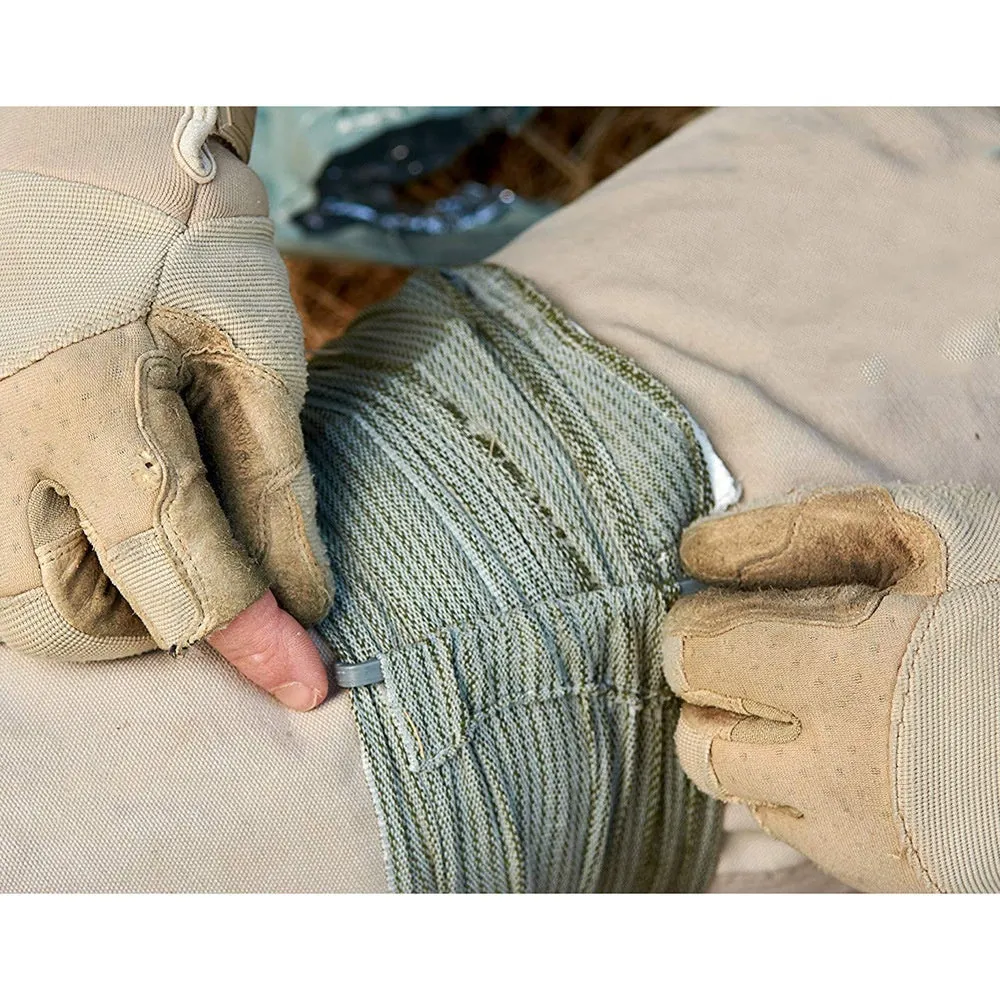 Portable hemostatic bandage kit with roll of tactical gauze tape for first aid and outdoor use.