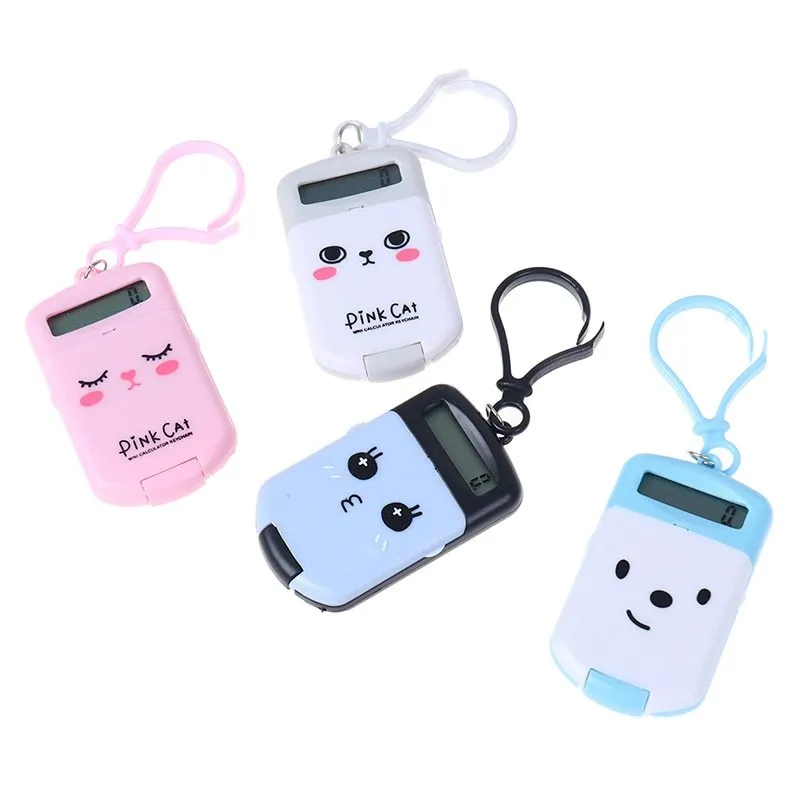 Creative cookie-shaped cute mini calculator in pink with key ring on a white background
