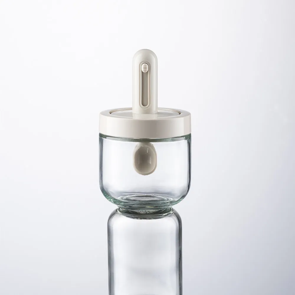 Glass telescopic spice seasoning bottle with leak-proof lid in transparent grey short style on kitchen counter
