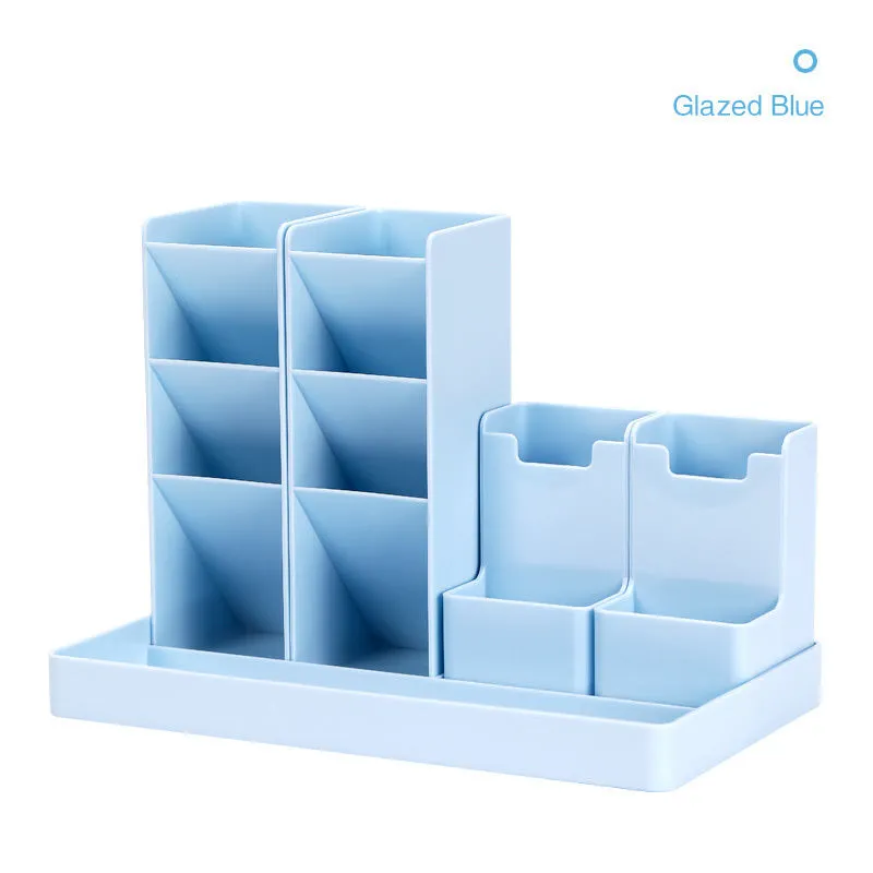 Combination pen holder in turquoise green with multiple storage grids for pens on a desk