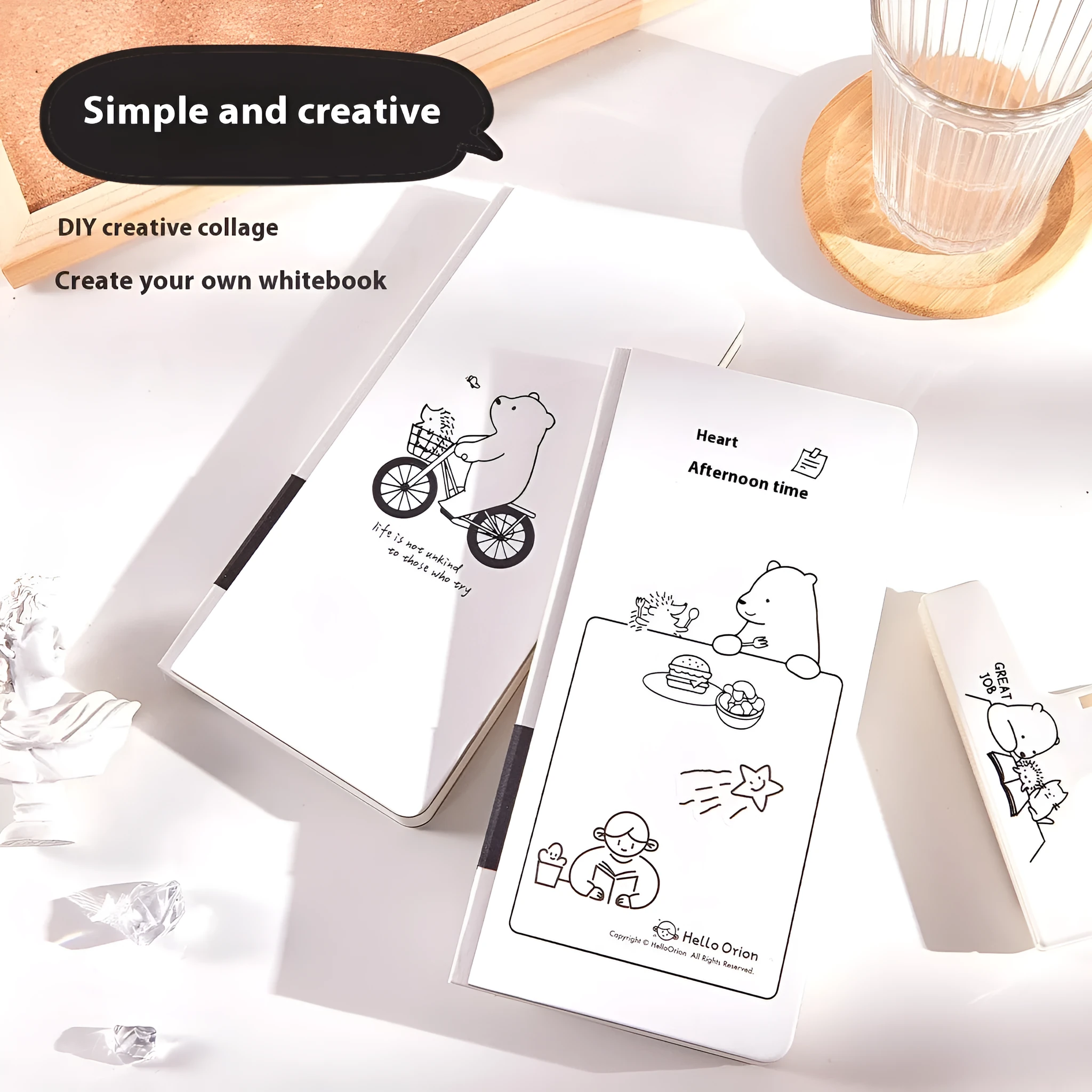 Small white paper notebook with plaid pages, mesh cover, and a pair of decorative stickers.