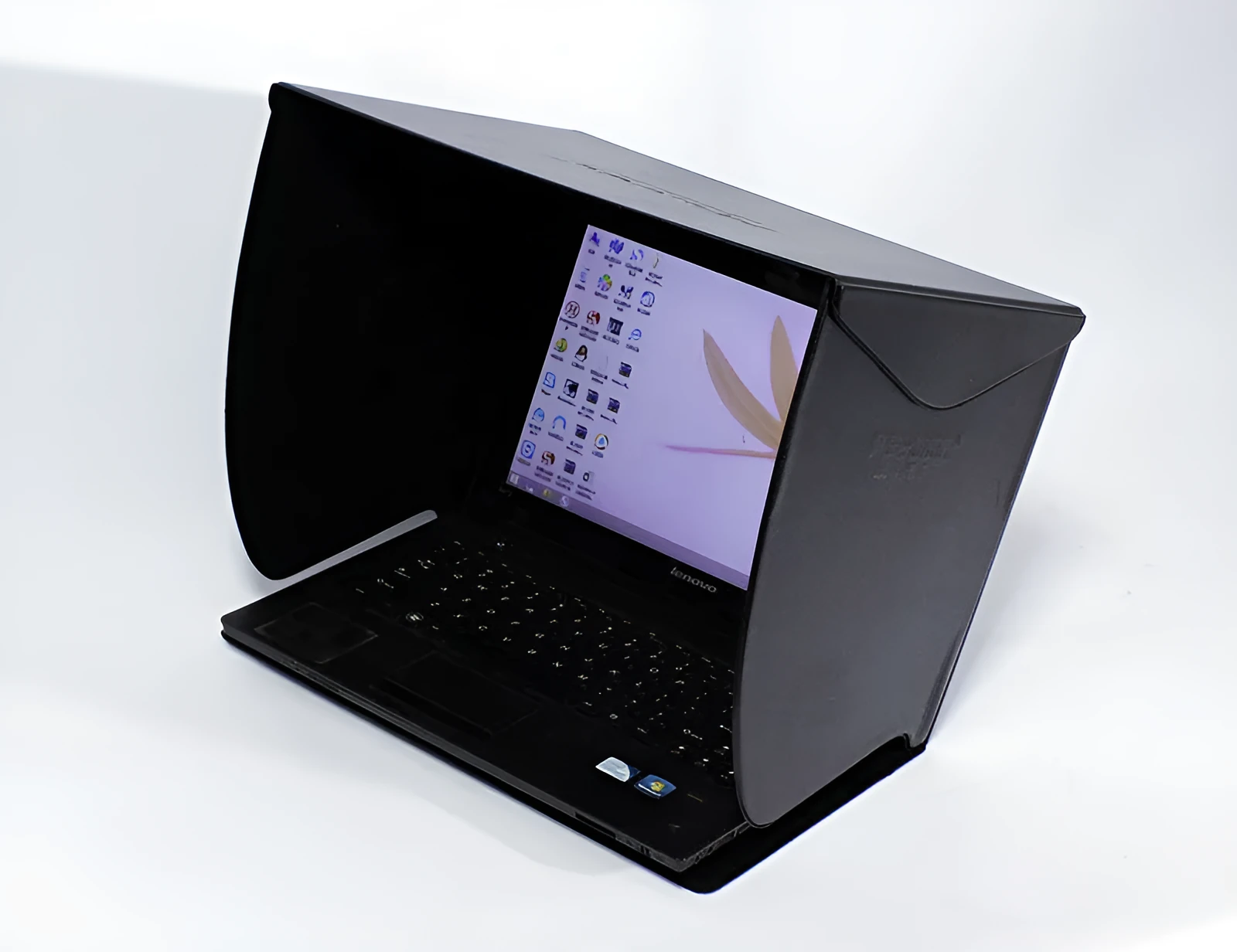 Black laptop sun hood folded flat showing PU outer and light-absorbing velvet inner lining