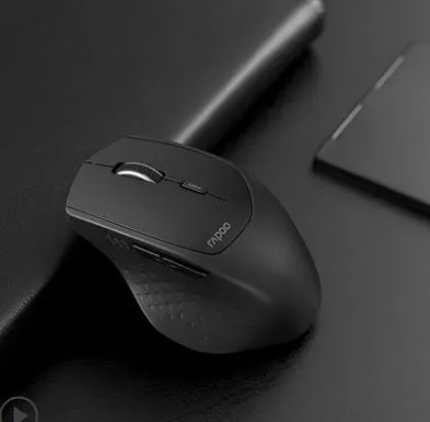 Rapoo MT500 wireless Bluetooth mouse in black with six buttons on a desk surface