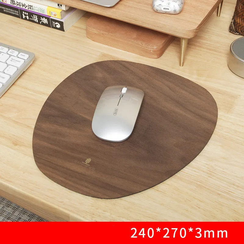 Extra large mouse pad with walnut wood surface and natural rubber base on a desk