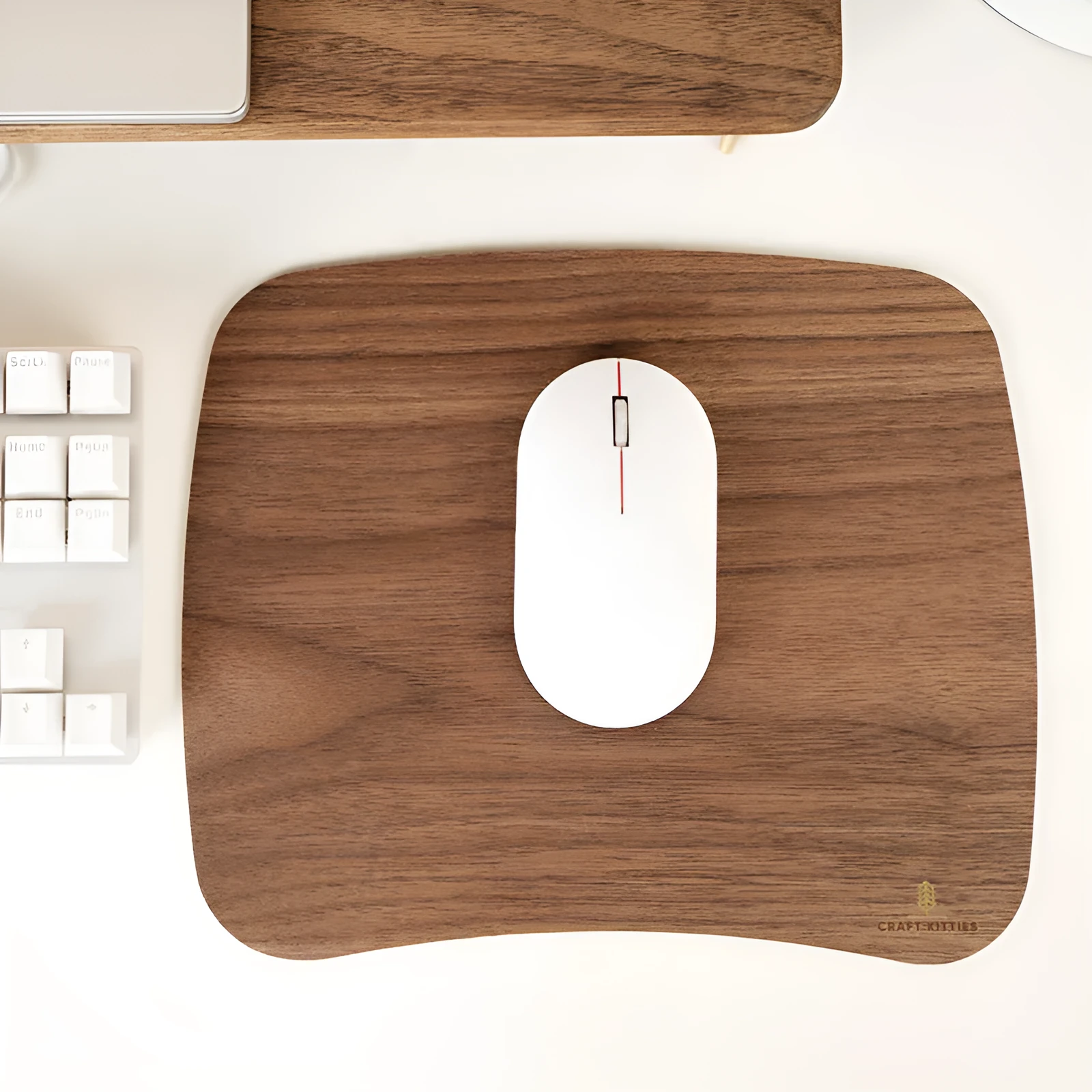 Extra large mouse pad with walnut wood surface and natural rubber base on a desk