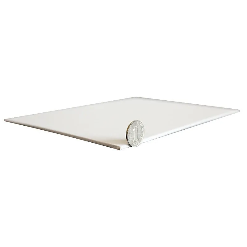 White primed cotton canvas panel oil painting board on flat surface