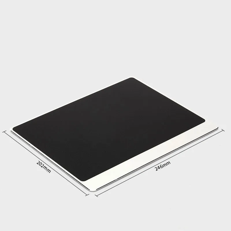 Metal alloy desk mat mouse pad in silver, large size, on a wooden desk