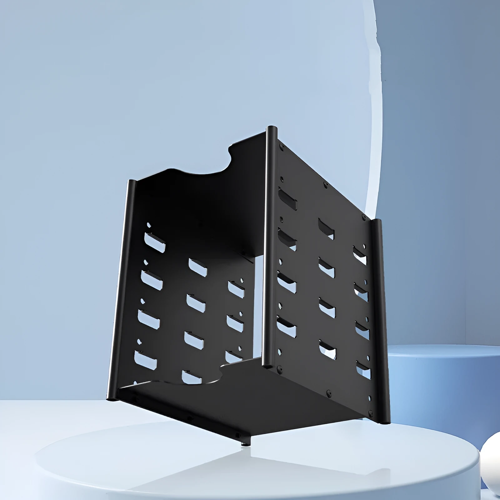 Black metal 5-layer hard drive storage bracket for 3.5-inch disks with screwdriver and screws on a desk