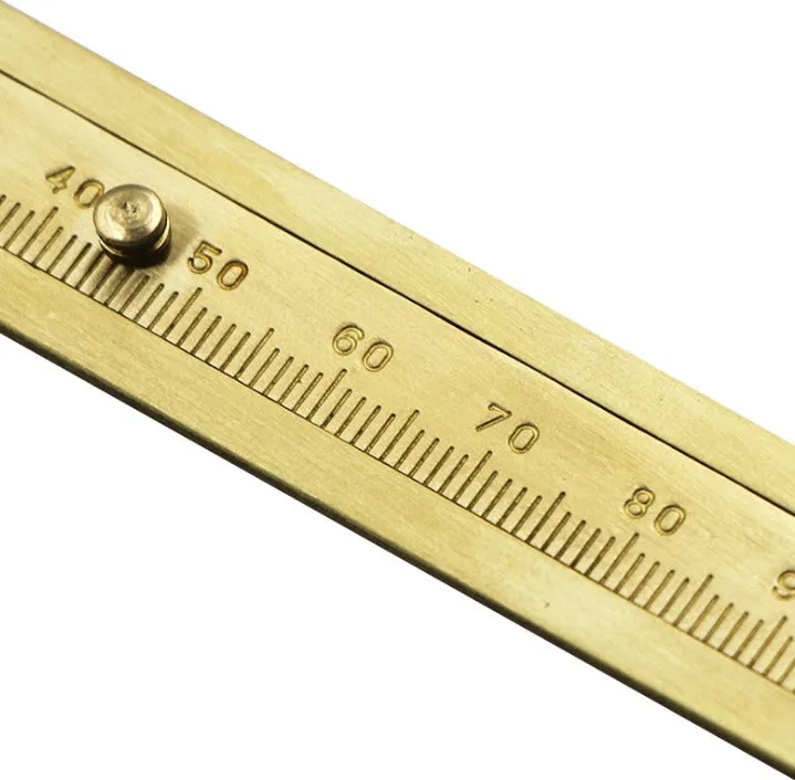 Double scale mini copper caliper 100mm brass vernier caliper with metric and imperial scales on white background