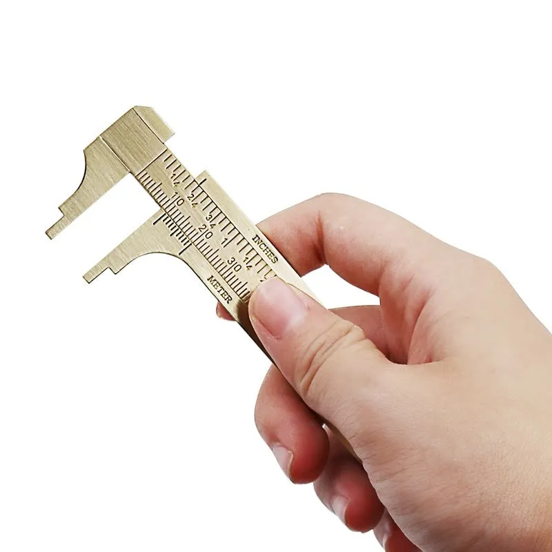 Double scale mini copper caliper 100mm brass vernier caliper with metric and imperial scales on white background