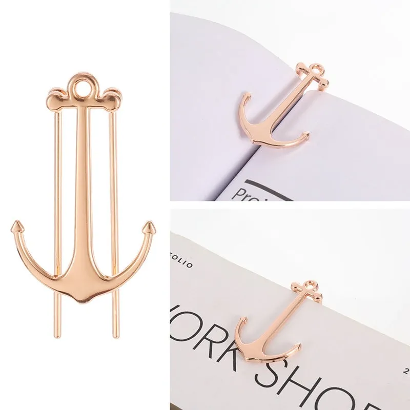 Creative metal bookmark page folder in silver colour, 1.78 x 6.6 cm, on an open book