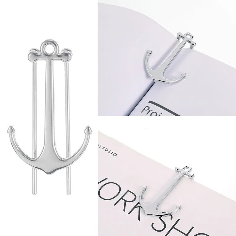 Creative metal bookmark page folder in silver colour, 1.78 x 6.6 cm, on an open book