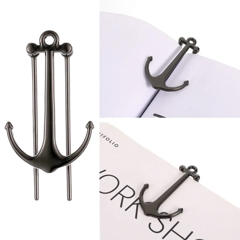 Creative metal bookmark page folder in silver colour, 1.78 x 6.6 cm, on an open book