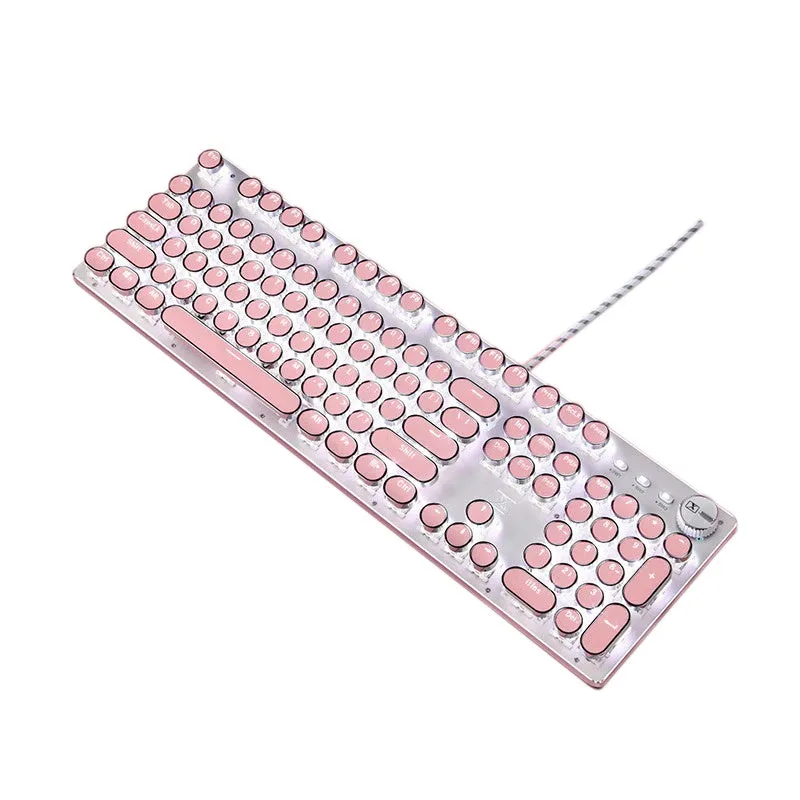Silver and pink mechanical keyboard with green switches and white backlighting on a desk.