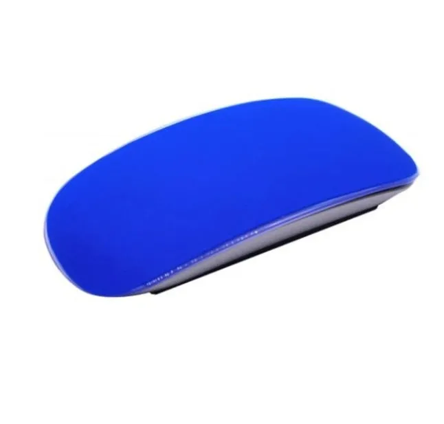 Silicone Magic Mouse cover skin in black on a white desk next to an Apple Magic Mouse