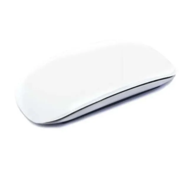 Silicone Magic Mouse cover skin in black on a white desk next to an Apple Magic Mouse