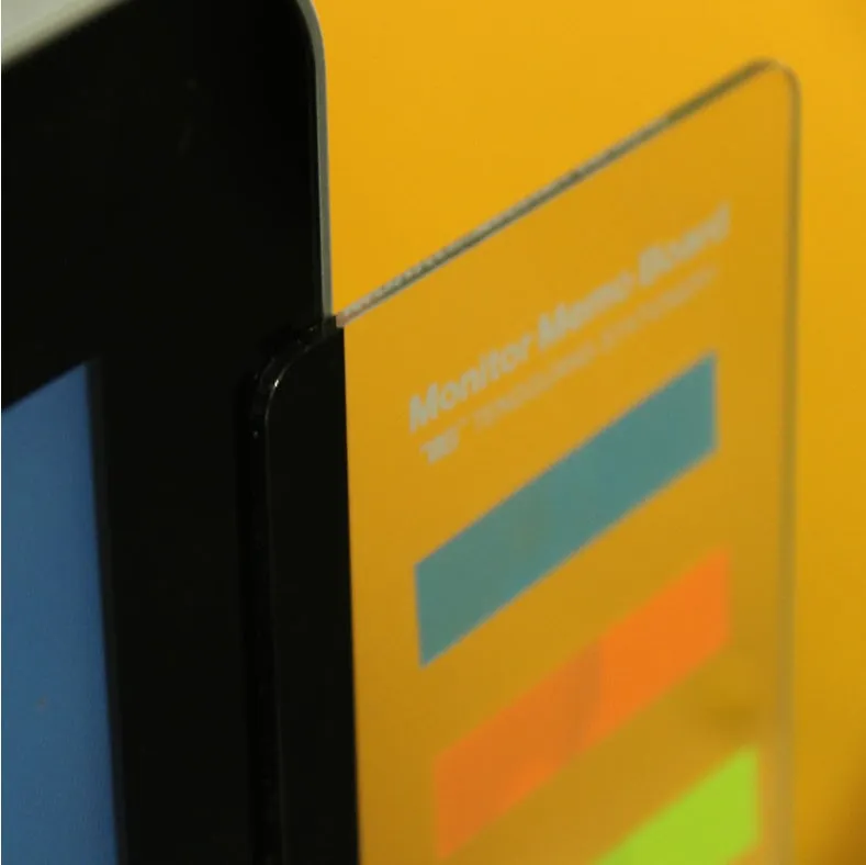 Clear acrylic computer monitor side pane 28cm x 7.8cm with sticky notes attached