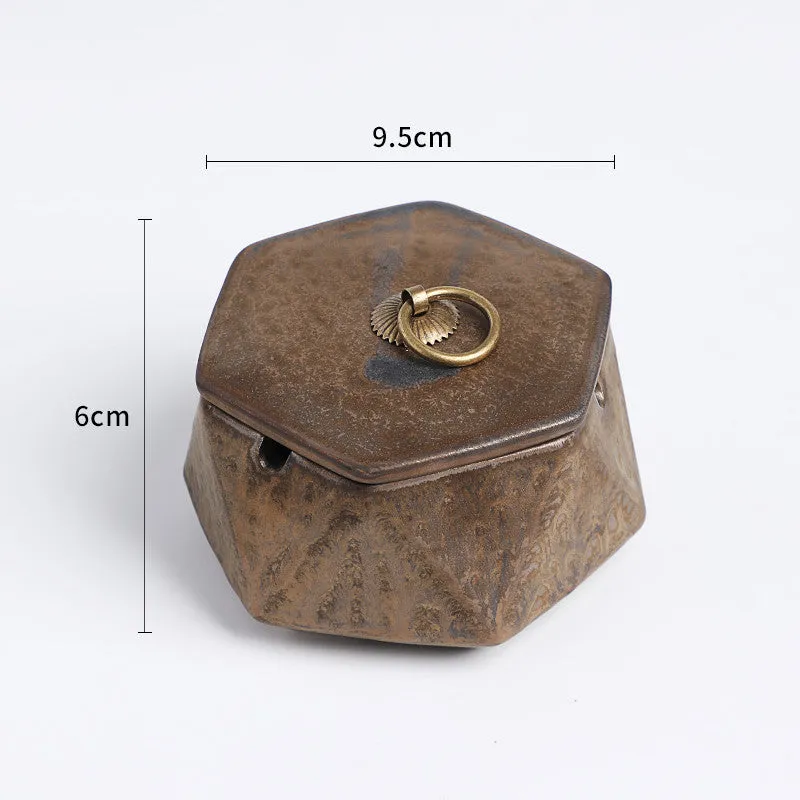 Ceramic ashtray with lid, Nordic style, available in multiple colours, on a tabletop