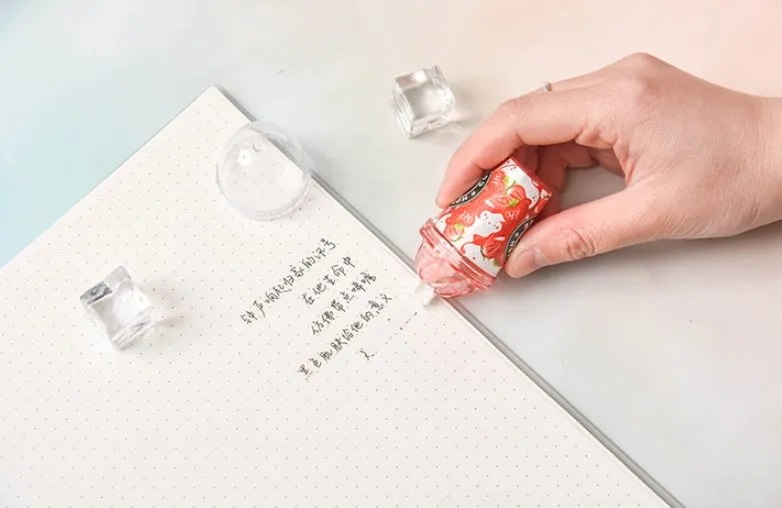 Plastic ice cream shape correction tape with 6 metre length in red shell on white background