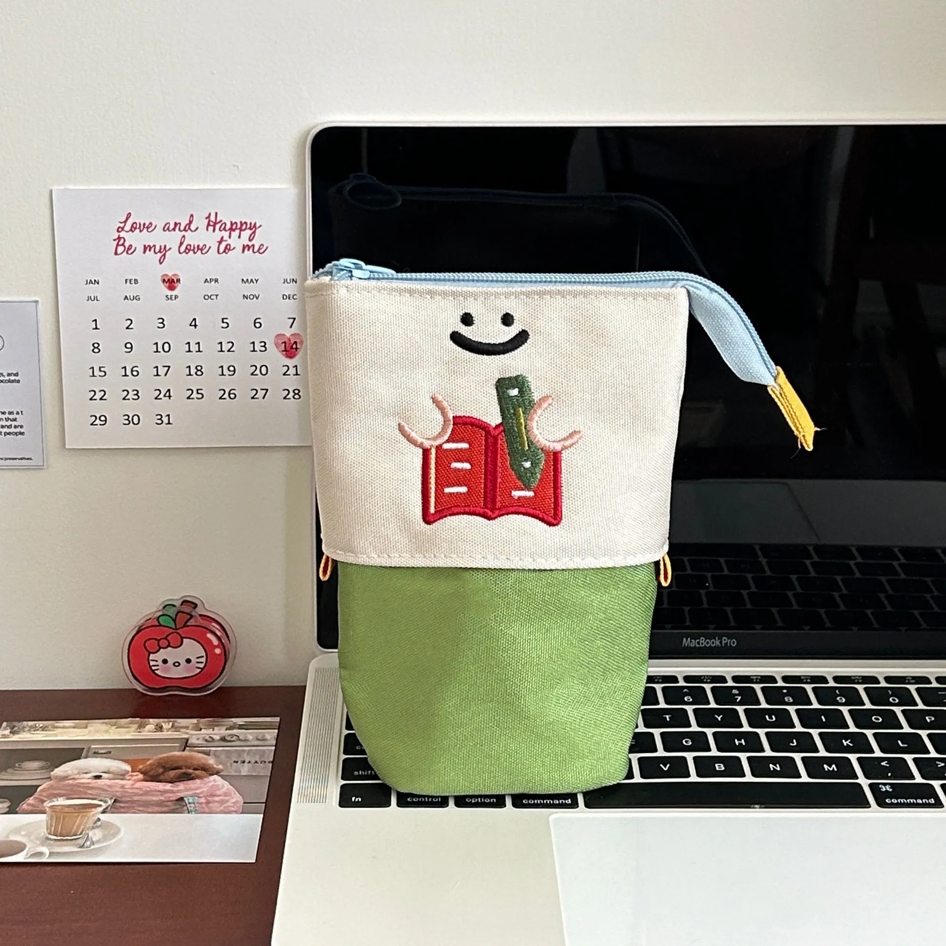 Brown collapsible cartoon design pencil case made from Oxford fabric, shown with zip open.
