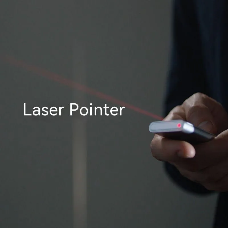 Silver wireless presenter with laser pointer and remote control on table