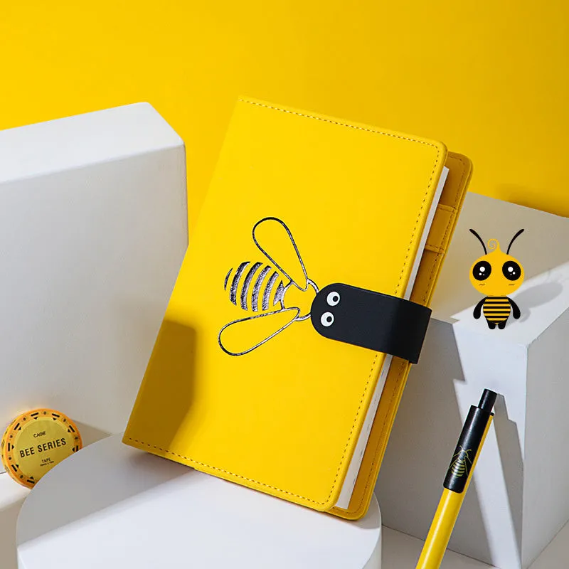 Open B6 notebook with 144 sheets, black PU cover, on a wooden desk